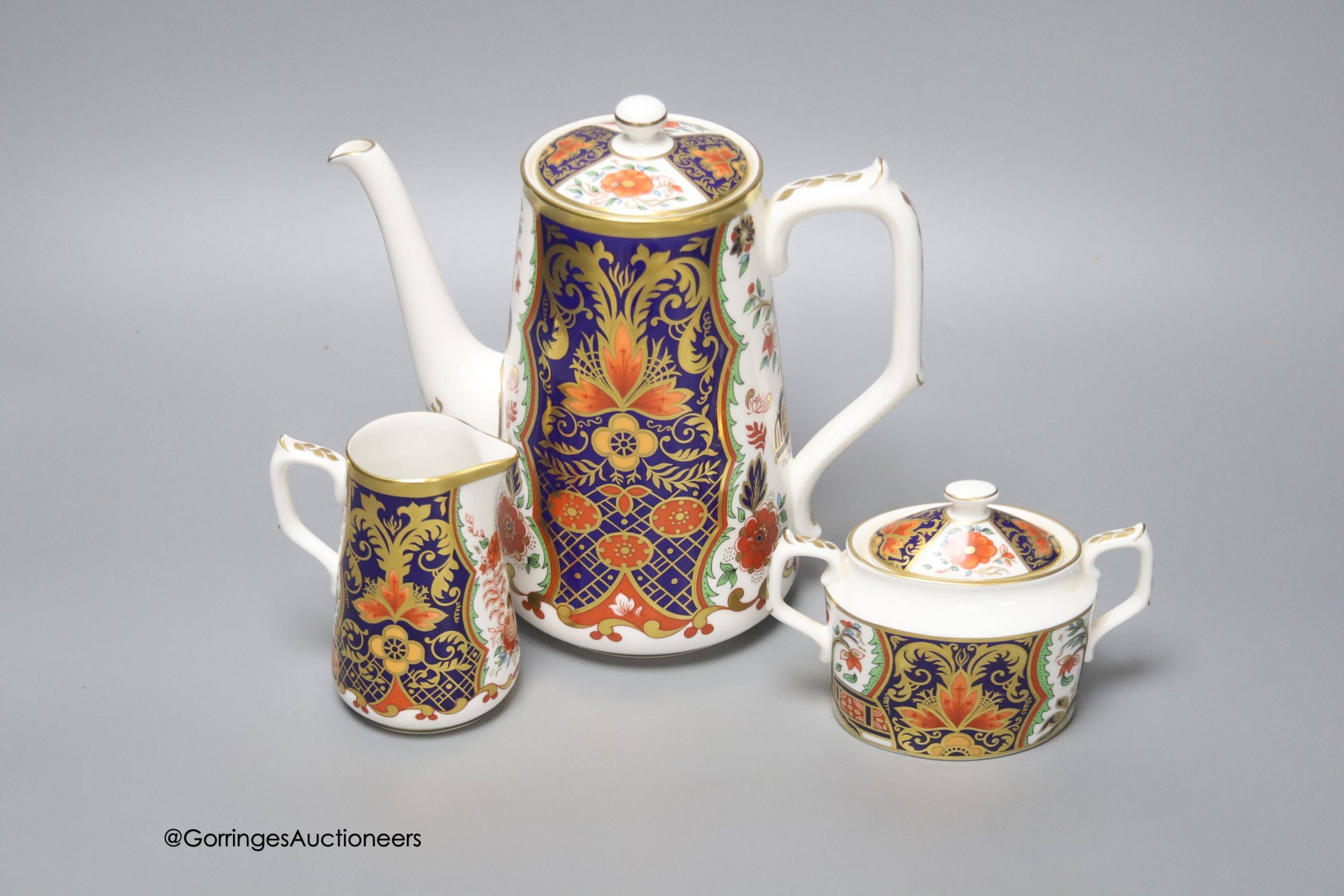 A Royal Crown Derby Rich Japan Pardoe pattern three piece coffee set, tallest 19cm